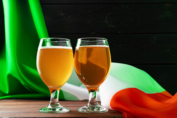 Glass of beer against flag of Ireland