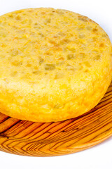 Spanish omelette on a wooden tray on white background