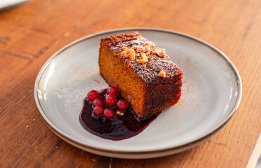 One slice of carrot cake with redcurrant jam.