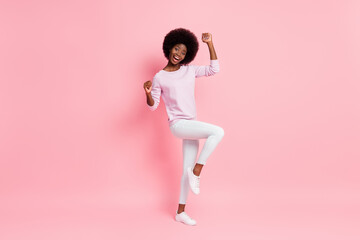Fototapeta na wymiar Full length body size view of cheerful wavy-haired girl wear comfortable clothes dancing having fun isolated over pink color background