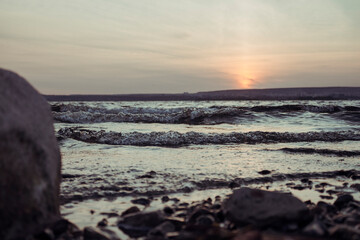 Fototapeta na wymiar waves on the sea at sunset