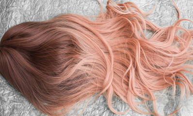 Wigs, natural and synthetic hair. Women's beauty concept. Close up photo of wig, hair for ladies