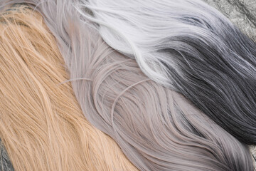 Wigs, natural and synthetic hair. Women's beauty concept. Close up photo of wig, hair for ladies