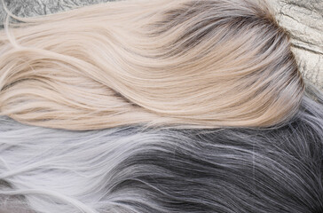 Fototapeta premium Wigs, natural and synthetic hair. Women's beauty concept. Close up photo of wig, hair for ladies