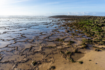 rocky and sandy beach on the Alentejo coast on Portugal at Milfontes