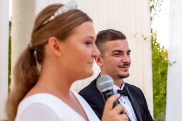 Young wedding couple sitting on chairs