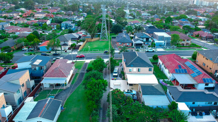 Panoramic Aerial View of Sydney Western suburbs showing house roof tops roads cars and other buildings 
