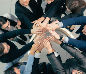 top view. group of young business people standing in a circle.