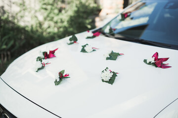 Wedding car decorated with beautiful, luxury flowers