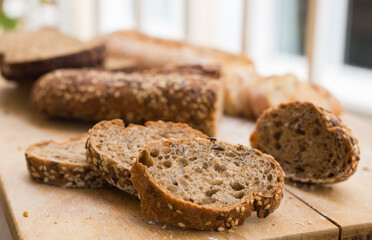 fresh loaf of bread on wooden board
