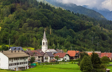 Fototapeta na wymiar Beautiful white church in small mountainous village in Italy