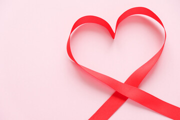 red ribbon in the shape of a heart