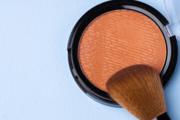 Decorative cosmetics face powder and brush close up