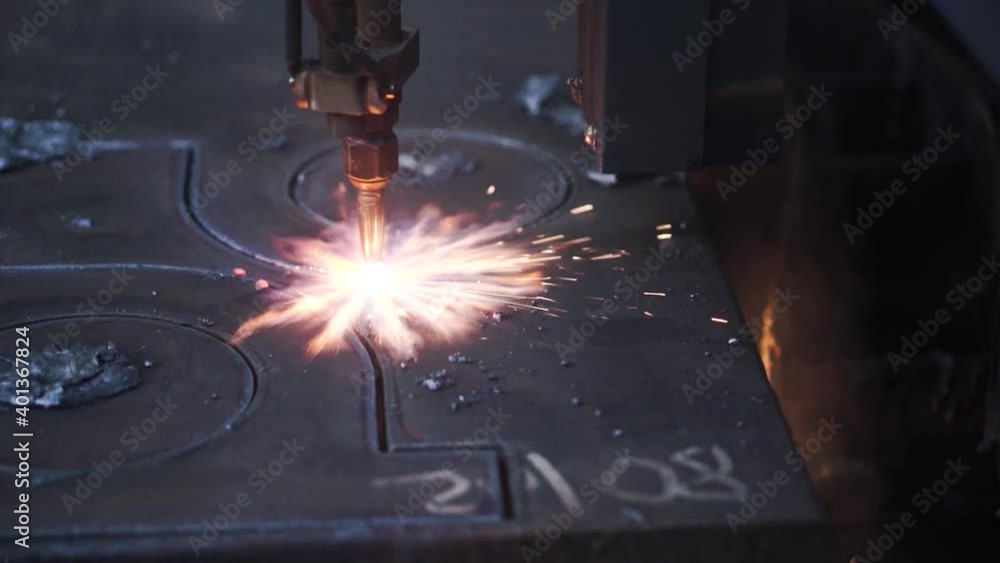Poster close-up of metal pattern welding machine. clip. automated welding machine creates beautiful pattern