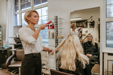 Hairdresser taking photo before dyeing hair