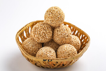Indian sweet for traditional festival makar sankranti :Rajgira laddu made from Amaranth seed in Bowl on white background