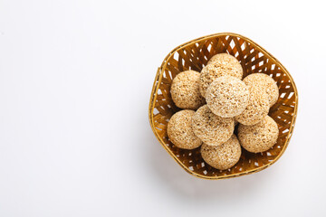 Indian sweet for traditional festival makar sankranti :Rajgira laddu made from Amaranth seed in Bowl on white background