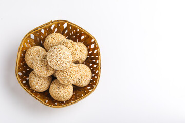 Indian sweet for traditional festival makar sankranti :Rajgira laddu made from Amaranth seed in Bowl on white background