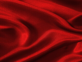 Shiny red crumpled fabric texture. Elegant wavy cloth background