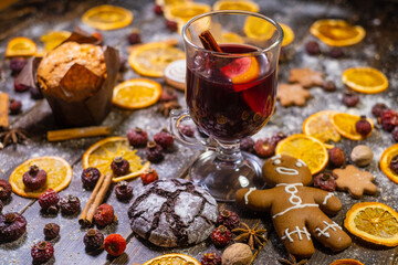 Mulled wine and desserts on table