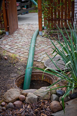 pumping septic tanks from the backyard tank in the countryside - 401370074
