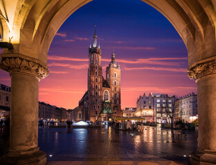 St Mary's Basilica (Mariacki Church) in the Old Town of Krakow (Cracow), Poland. Illuminated on The Main Market Square at night after sunset
