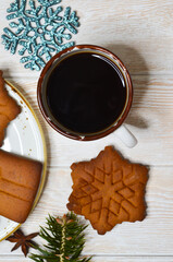 New Year's atmosphere, Christmas mood and coziness, warming winter coffee drink, relaxation at home on holiday, snowflake-shaped cookies, holiday baked goods