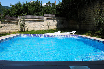 Modern swimpool in the backyard with beautiful mountain views
