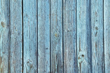 wooden planks covered with rubbed blue paint