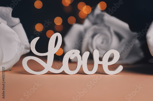 The word love in white letters on light background. Happy Valentine's Day, Mother's Day, March 8, World Women's Day holiday concept