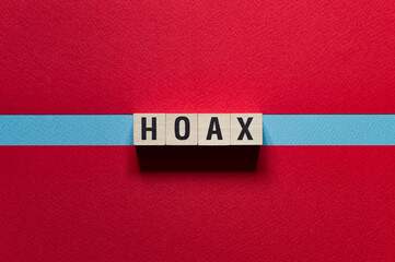 Hoax word concept on cubes