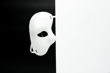 A picture of masquerade in black and white background. Life is theatrical.