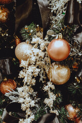 Christmas tree branches decorated with golden festive balls. New year 2021 mood
