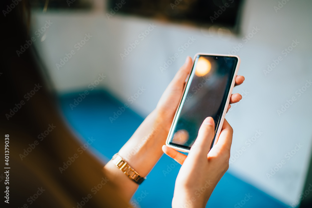 Poster selective focus on female hands holding cellphone technology for browsing internet website during le