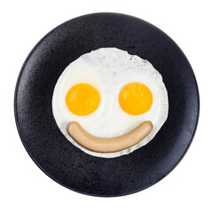 top view of fried eggs and boiled sausage on black plate isolated on white background. Fried eggs like smiling face