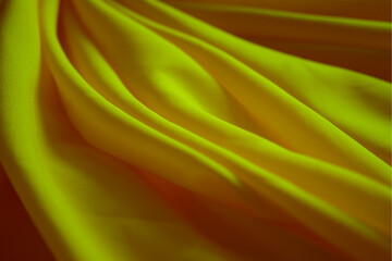 Luxurious satin yellow gold silk or fabric. soft waves cloth abstract background. 
