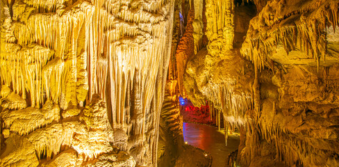Illiuminated prometheus cave and pathway with no tourist. Travel spots and sightseeing in Georgia.