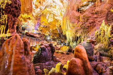 Stunning view inside Prometheus cave with no tourists and illiuminated geological formations
