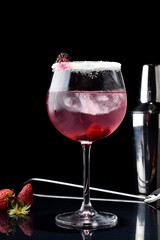 drinks in glass and glass with lemon, red berries and strawberries with shaker in elegant background