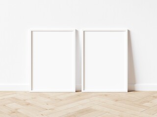 Two blank vertically oriented rectangular exhibition backgrounds with white border standing on wooden floor. 3D Illustration.
