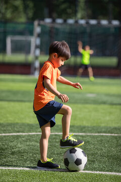 Children playing football on field