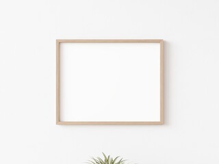 Single empty horizontally oriented rectangular picture frame with thin wooden border hanging on white wall. 3D illustration.