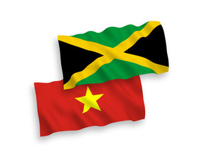 National vector fabric wave flags of Jamaica and Vietnam isolated on white background. 1 to 2 proportion.