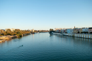 the Guadalquivir river runs through the beautiful Seville in Andalusia