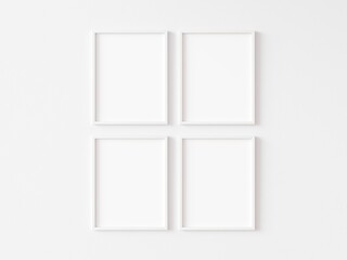 Four blank vertically oriented rectangular picture frames with thin white border hanging in two rows on white wall. 3D illustration.