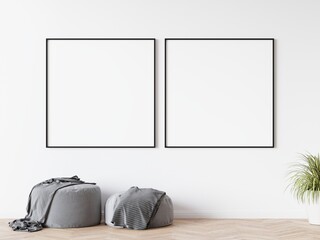 Two blank square picture frames hanging on white wall in living room. Wooden parquet floor. 3D illustration.