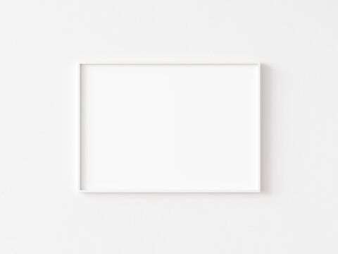 Single blank horizontally oriented rectangular picture frame with thin white border hanging on white wall. 3D illustration.