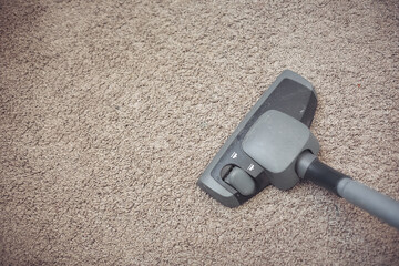 home cleaning, vacuuming carpet, top view