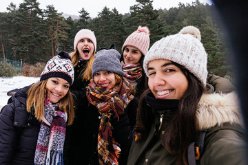 Woman enjoying a snowy day with friends