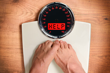 Weight concept with feet weighing on scale help message
